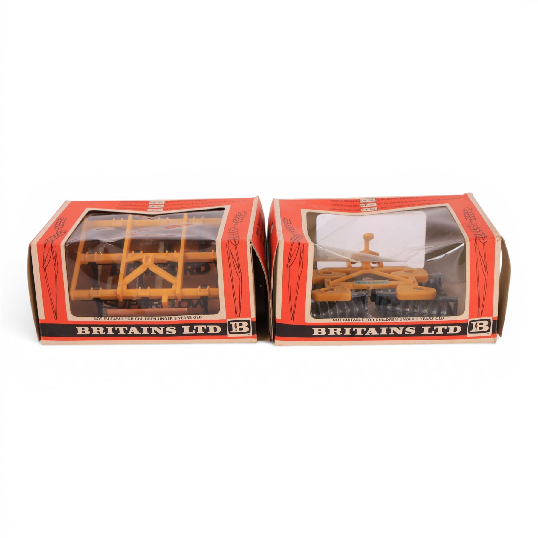 Britains Ltd 1:32 scale farm implements, comprising no. 9556 Hay Baler, no. 9549 Manure Spreader, no. 9553 Disc Harrow, no. 9557 Bale Sledge, no. 9577 Seed Drill, no. 9561 Cultivator Herse, no. 9546 Ploughs and no. 9558 Wheeled Trailer, all boxed