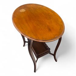 Set of two early 20th century mahogany occasional tables, comprising an oval example with under-tier and galleried shelf on swept supports, and a drop-leaf Sutherland table with turned gateleg supports and stretcher base (Oval H 74cm, W 57cm, D 86cm) (Sutherland H 71cm, W 30cm-94cm, D 76cm)
