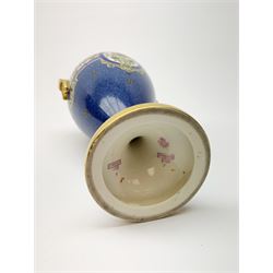 An early 19th century Royal Worcester porcelain vase and cover, of baluster form with twin gilt handles, raised upon a spreading circular foot, decorated with Persian style foliate enamelled panels upon a blue ground, with puce printed marks beneath, rd no 669183, shape no 2713, H29cm.  