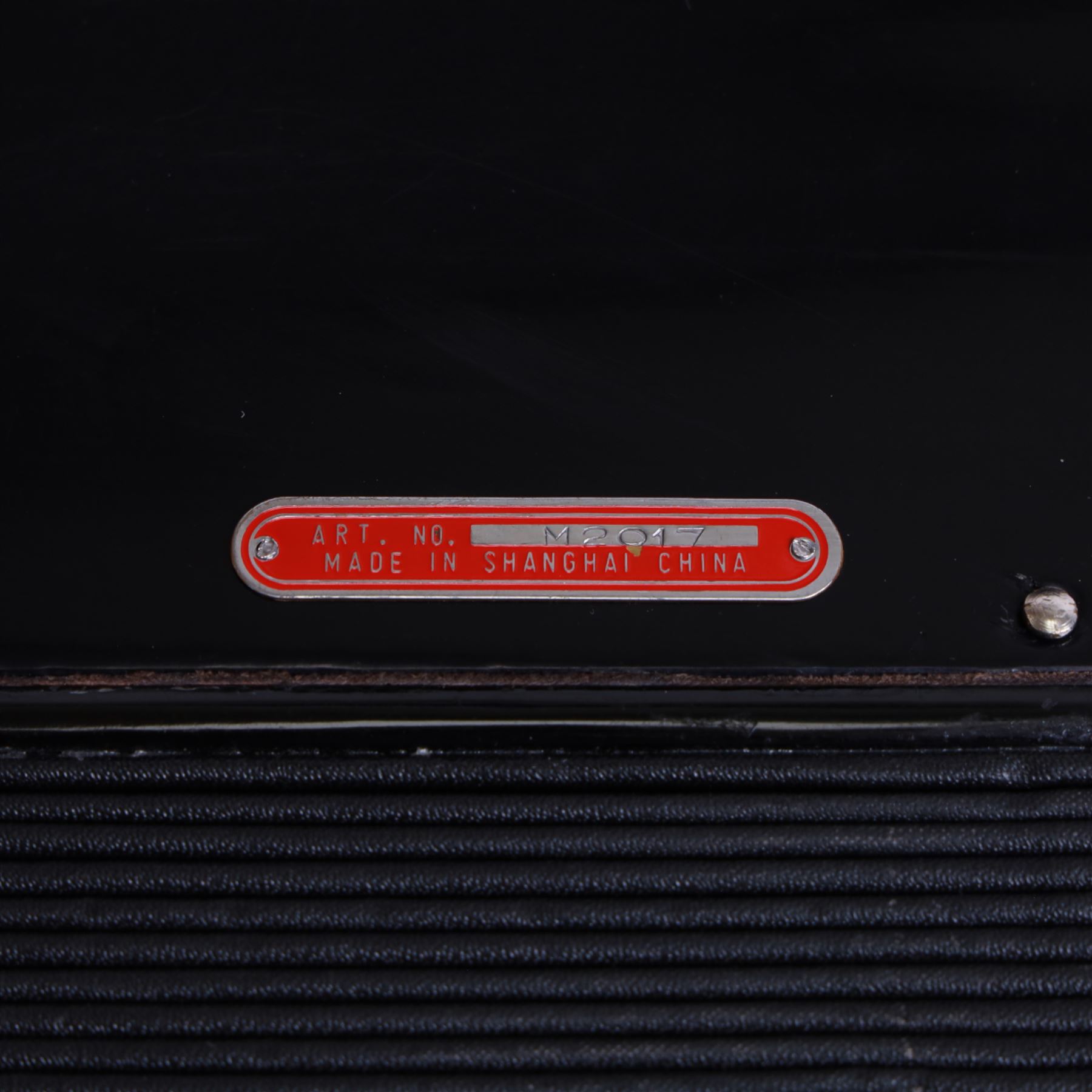 Bai-Le-20th century Chinese Piano Accordion, three octave keyboard with 96 treble buttons and 7 base keys, 16-fold bellows with shoulder straps and hard carrying case.