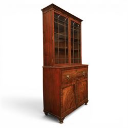 Early 19th century mahogany secretaire-bookcase, projecting cornice above astragal glazed ...