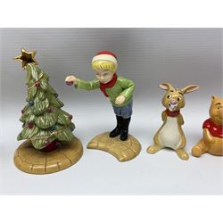 Seven Beswick Winnie the Pooh figures, comprising Pooh Bear, Tigger, Piglet, Kanga, Mr Rabbit, Owl, and Eeyore, together with two Royal Doulton Winnie the pooh Christmas Collection figures, 'The Most Perfect Tree in all the Wood', and 'Christopher Robin Dresses the Tree', (9)  