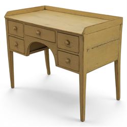 Pine country writing desk, rustic cream paint finish, galleried top over a central drawer flanked by two drawers, tapered square supports