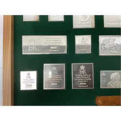 The Stamps of Royalty collection consisting of twenty-five sterling silver hallmarked stamp replicas, housed in a fitted wooden display case, with certificates, polishing cloth and certificates