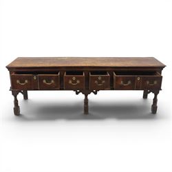 17th century 8’ oak dresser base with moulded front, rectangular top, above four drawers, raised on turned and block support 