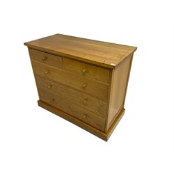 Craftsman made light oak chest, fitted with two short and three long drawers, on plinth base