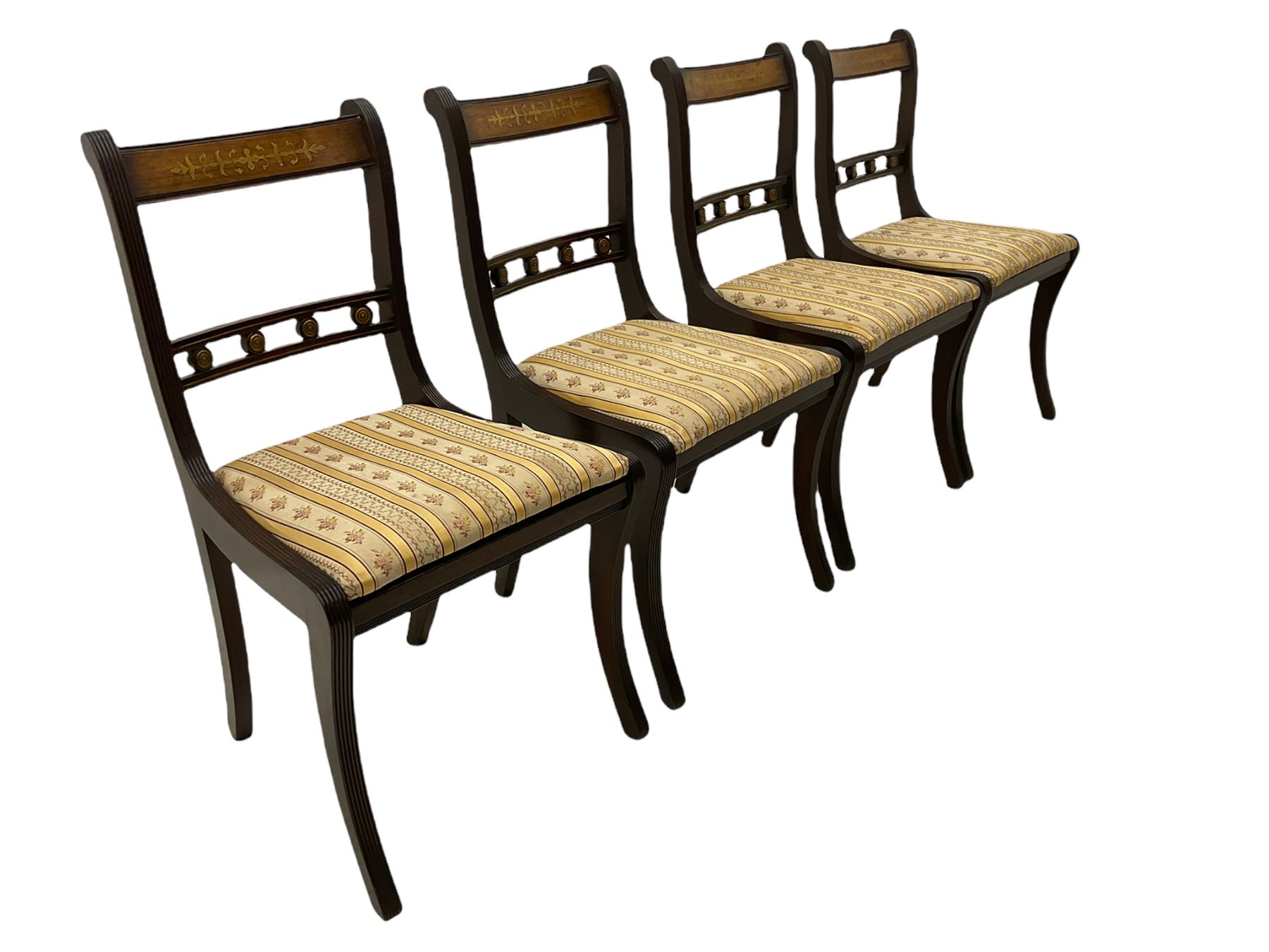 Set of eight Regency style mahogany dining chairs, brass inlay with gilded detail