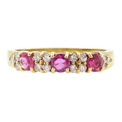 18ct gold three stone round cut ruby and round brilliant cut diamond ring, London 1991