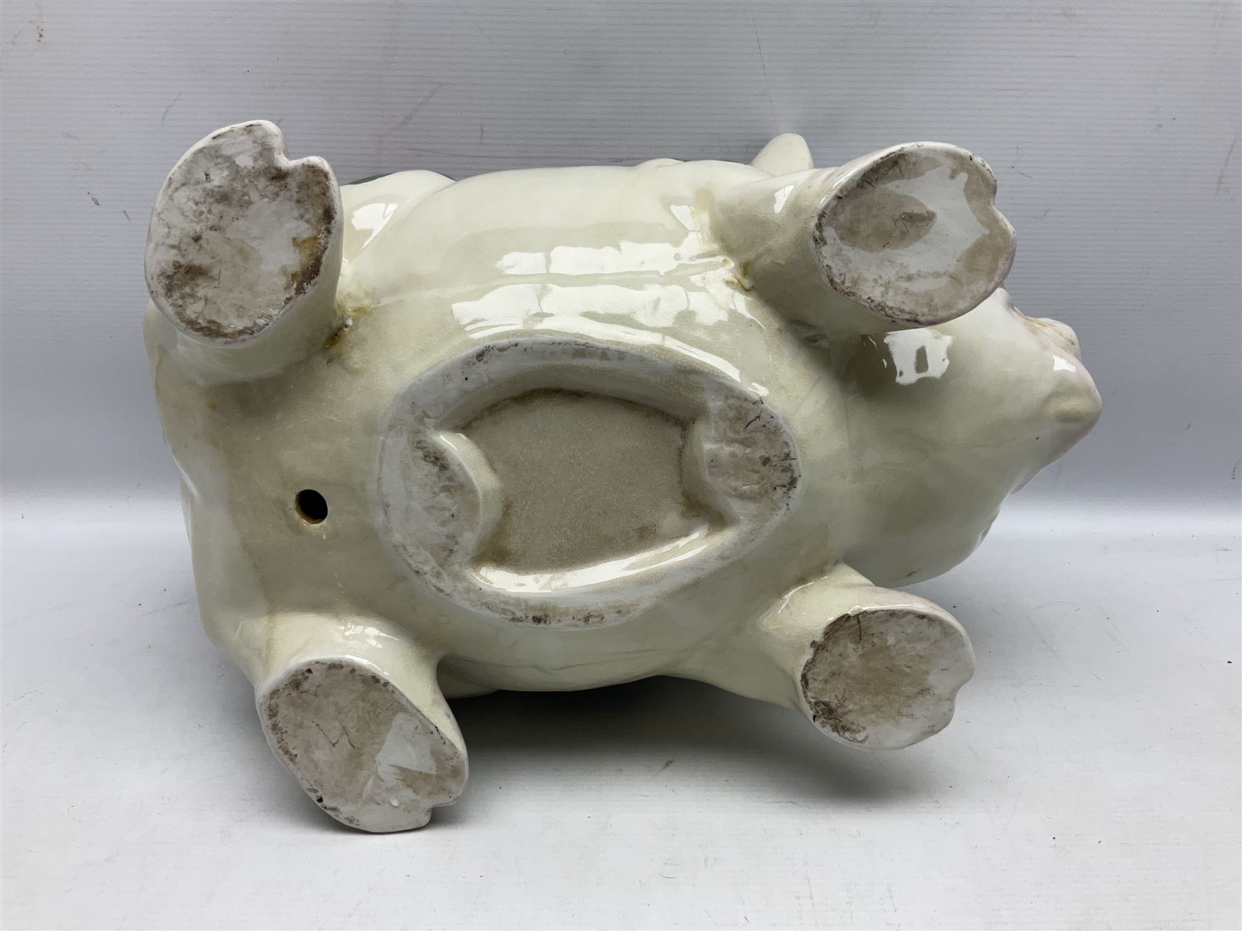 Large ceramic figure of a pig decorated with roses, L45cm