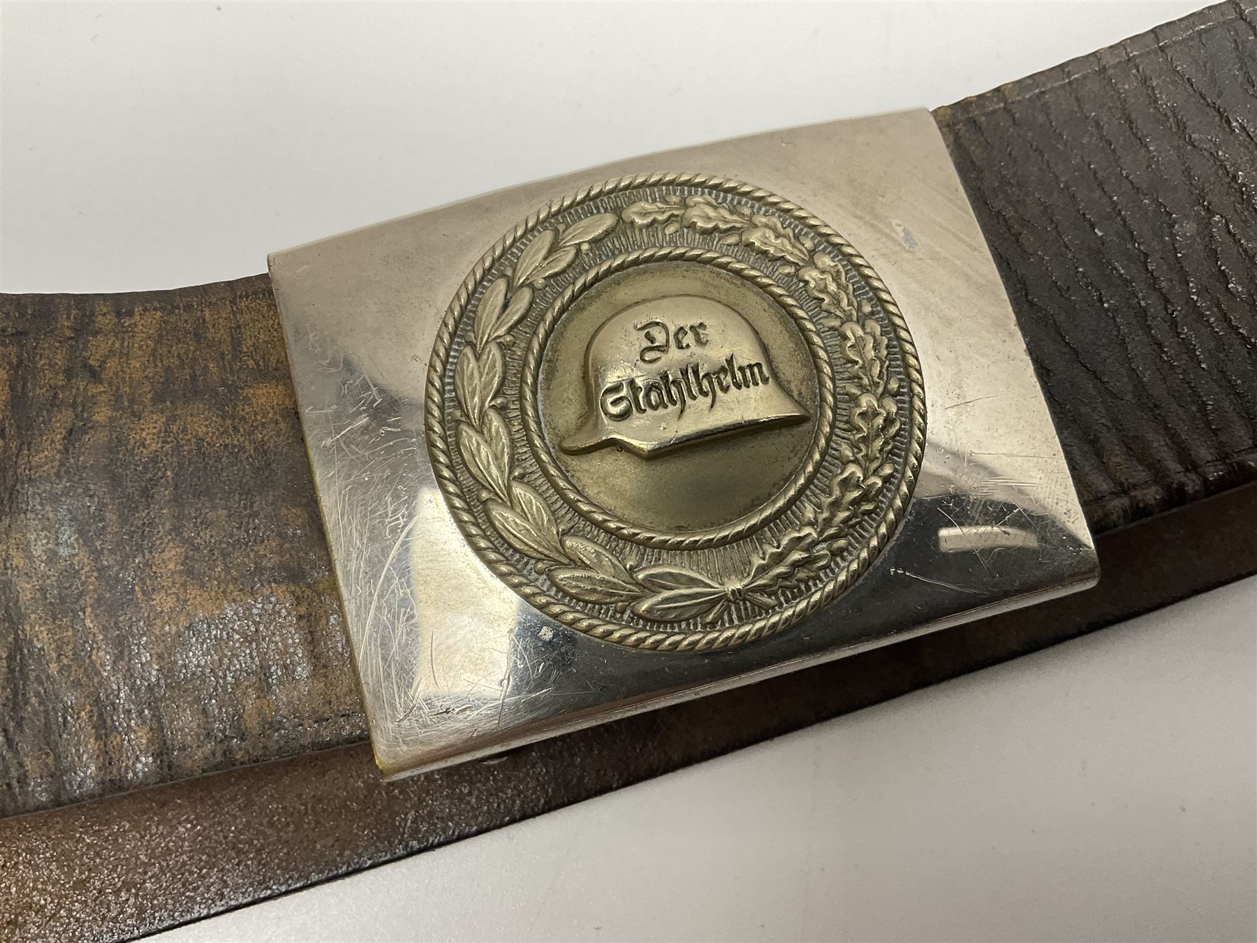 Pair of WW2 German Other Ranks trousers c1940-42, stamped C.& A. Brenninkmeyer Workstatten; WW2 German Army webbing belt with steel 'Gott Mit Uns' buckle; and WW2 German leather belt with 'Stahlhelm' (Steel Helmet League) members buckle (3)