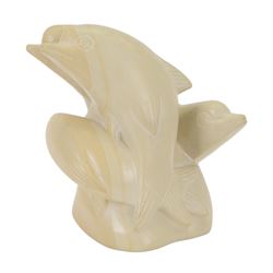 Stone carving, modelled as four dolphins, H22cm