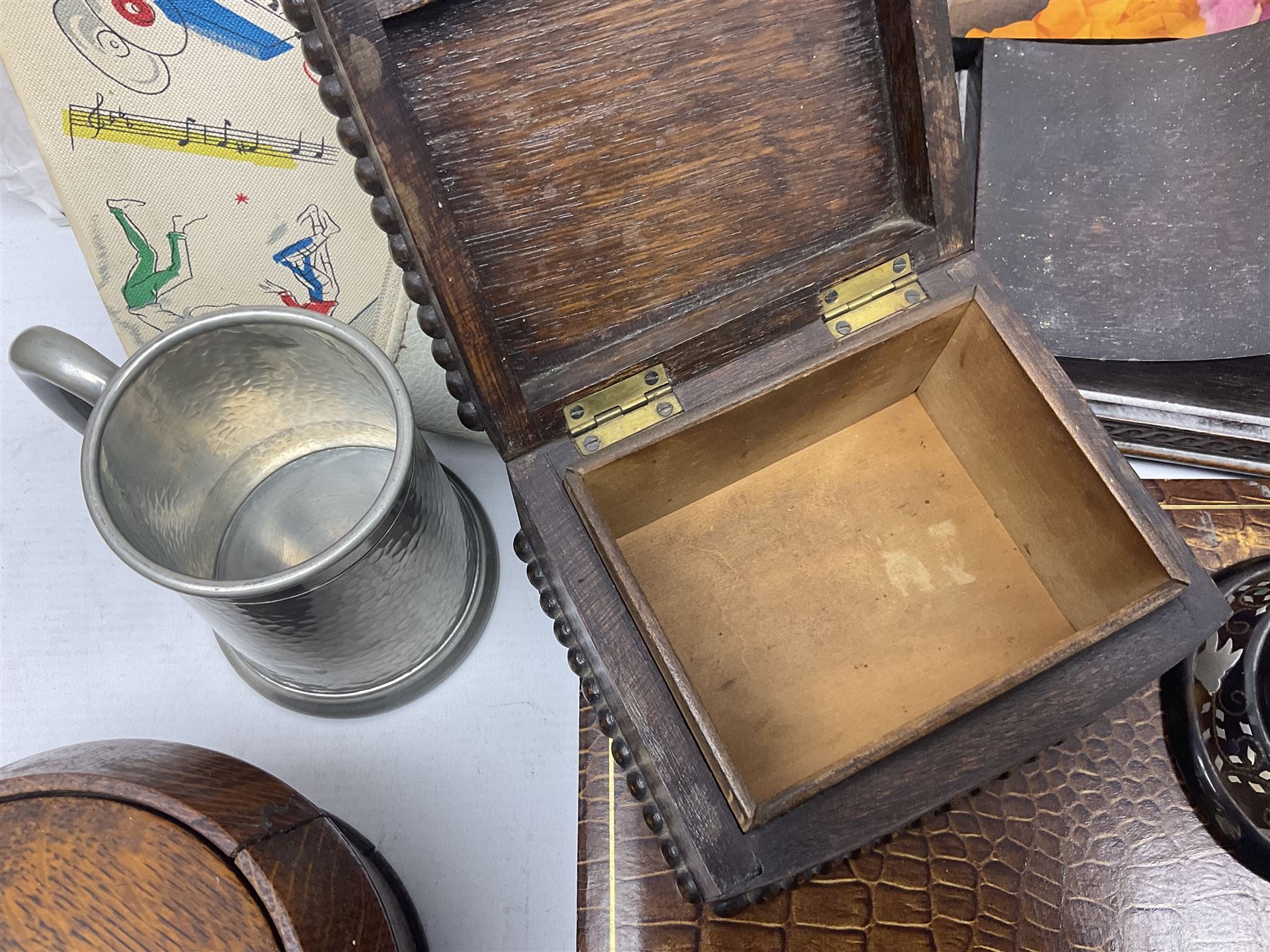 Mid 20th century cigarette box in the form of a gondola, the faux tortoiseshell with mother of pearl inlay (a/f), cased mantel clock with silvered numerical dial, oak lidded tea jar caddy, oak box, silver-plate cutlery, quantity of records, Smith's empire miniature clock, stamps etc