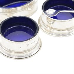 Group of silver cruet items, comprising pair of Art Deco salt and pepper shakers, of tapering cylindrical form, hallmarked Viner's Ltd, Sheffield 1933, pair of silver open salts, pair of salt shaker, and a matching pepper shaker and open salt, all hallmarked