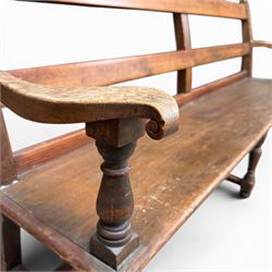 Early 20th century pine and oak bench seat, stained pine rail back frame with shaped oak arms