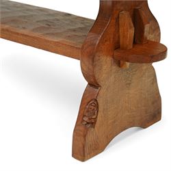 Gnomeman - oak rectangular coffee table, the thick plank top with exposed pegged joints, raised on shaped slab ends united by a lower undertier, carved with the signature gnome to one support, by Thomas Whittaker of Littlebeck