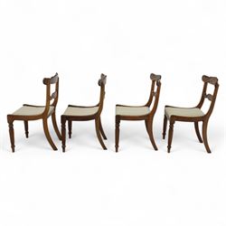 Set of four 19th-century rosewood dining chairs in the William IV style, shaped and carved top rail with fan and scroll decoration above a upholstered padded seat on reeded and turned front legs 