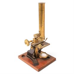 Early 20th century brass microscope, with spare lenses and a small collection of prepared ...