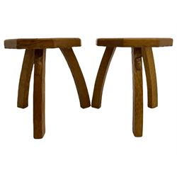 Two Yorkshire oak three legged stools, one carved with bird