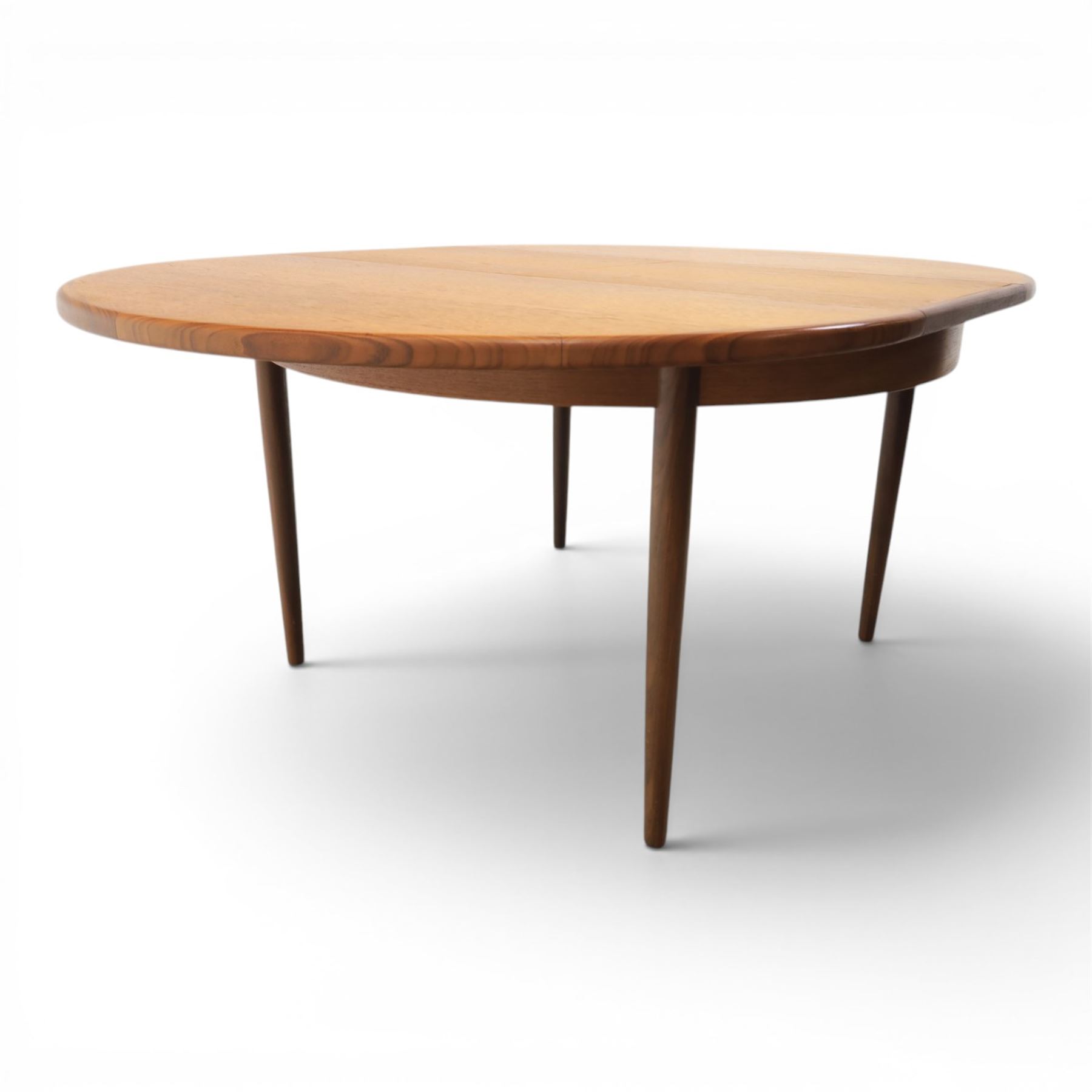 G-Plan - mid-20th century teak 'Fresco' circular extending dining table and six chairs, circular top with storable fold-over leaf extending to 166cm