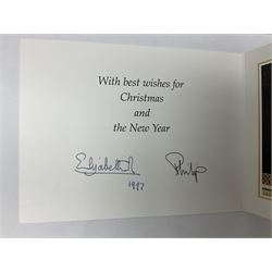 HM Queen Elizabeth II and HRH the Duke of Edinburgh - signed 1997 Christmas card with two gilt cyphers to front and colour photographic portrait inside,  signed Elizabeth R and Philip with manuscript date 1997 below
