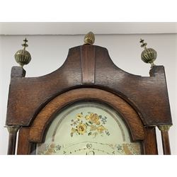 Early 19th century oak longcase clock, shaped pediment over a stepped arch glazed door enclosed by plain pilasters, the case with canted corners and trunk door with sloped arch top and centre curved return, enamel Arabic dial painted with flowers and patterned spandrels, signed 'Jno. Hilbert, Haxby', eight-day movement with subsidiary seconds dial and false calendar dial 