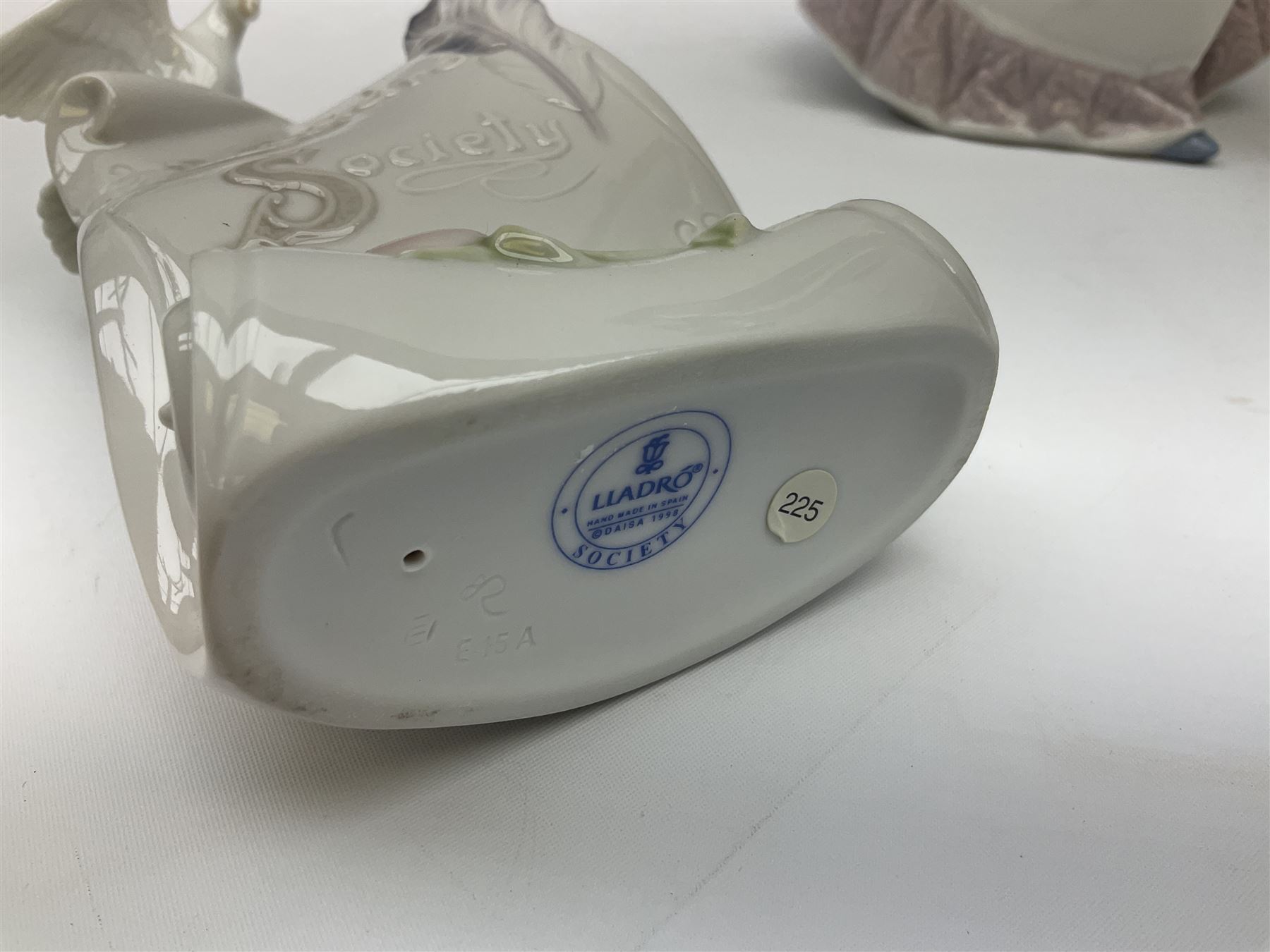 Three Lladro figures, comprising, Dreams of Summer Past no 6401, Spring Breeze no 4936 and Breezy Afternoon 5682 together with Lladro plaque Art Brings us Together no 7677, all in original boxes, largest example H35cm