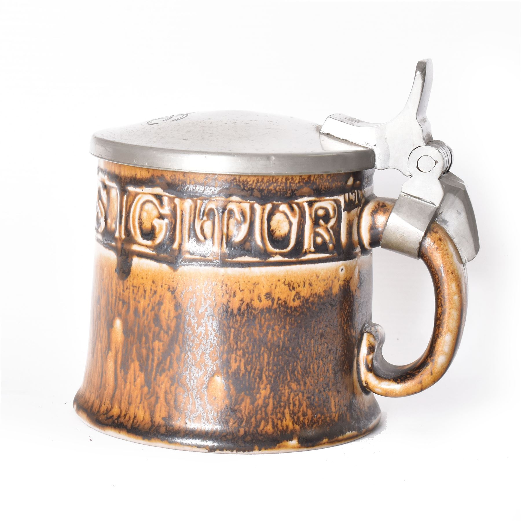 Arts and Crafts or Jugendstil tankard by Richard Riemerschmid, circa 1906, the cylindrical stoneware body reading 'Gaudeamus Igitur' (therefore let us rejoice), and finished in a brown glaze, with engraved slightly domed hinged lid, impressed mark beneath for Reinhold Merkelbach Grenzhausen, model number 2026 W, H14.5cm 