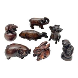Seven carved netsukes, to include koi carp, pig, rat, rabbit etc
