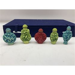 Ten modern Oriental scent bottles within a display case