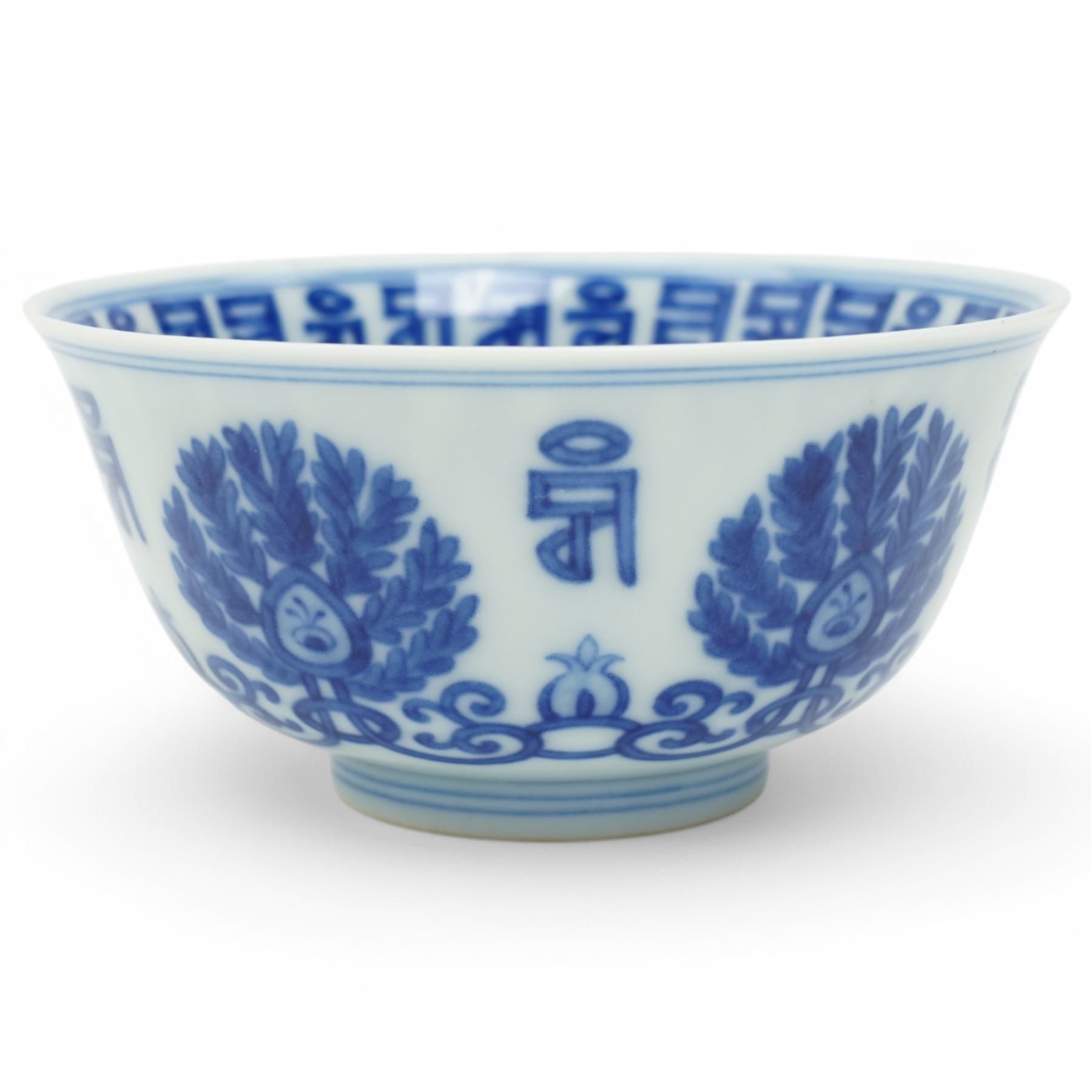 Qing dynasty bowl decorated in blue and white with palmettes and interlocking scrolls with a siddham script border, four character mark D10cm