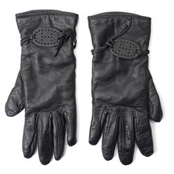 Hermès - pair of black leather gloves, lined in 100% cashmere, with pierced oval leather s...