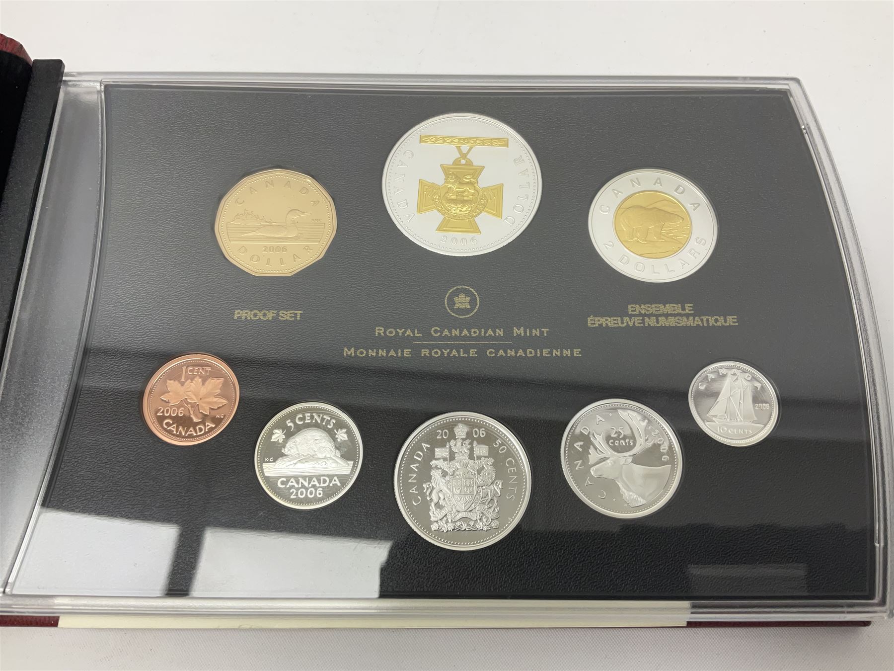 Queen Elizabeth II The Royal Canadian Mint 2006 silver proof dollar and two 2006 proof sets of Canadian coinage, all cased with certificates 