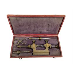 Late 19th century French watchmakers pivoting tool with a pair of brass external measuring callipers and attachments, in original velvet lined box.