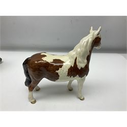 Three Beswick figures, comprising Skewbald Pinto Pony no 1373, Shetland pony mare, model 1033 and Elephant with trunk raised, all with printed mark beneath, largest H20cm 