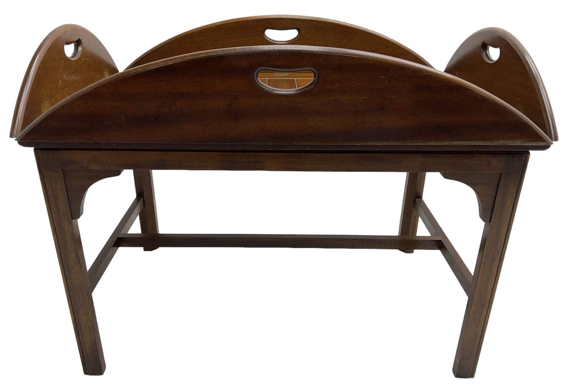 Mahogany butler's tray top coffee table, the removable tray with hinged sides and ends pierced with handles, on square moulded supports united by H stretcher 