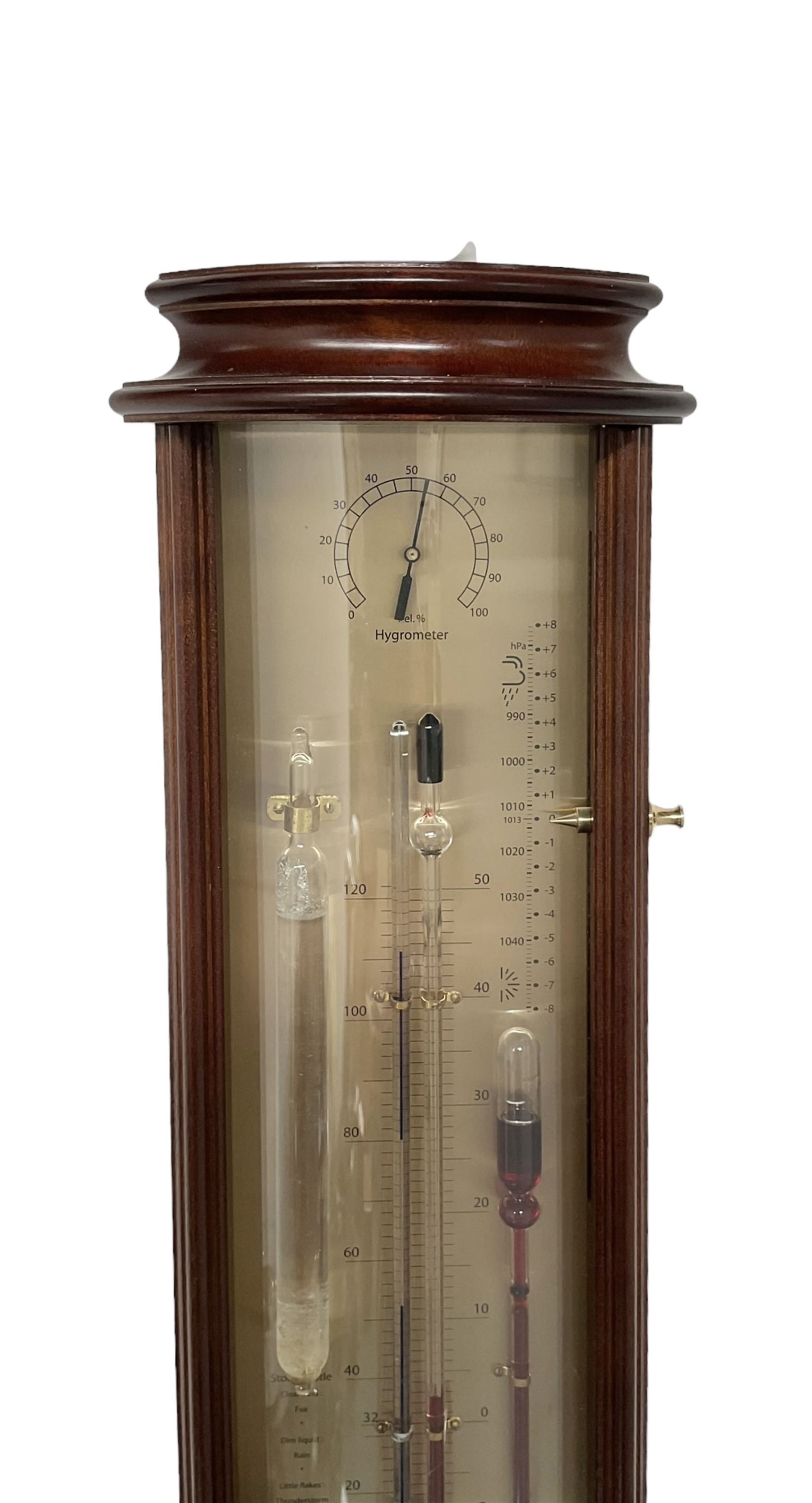 20th century Tendency Barometer -  to the design of Alexander Adie the 19th century inventor of the Sympiesometer, in a mahogany convex case with astragal moulding to the top and base, with an engraved silvered register, spirit thermometer, comparison Sympiesometer bulb and storm glass, adjustable vernier and hygrometer.

