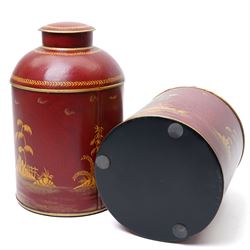 Pair of red toleware style tea cannisters, painted with fishermen, H36cm 