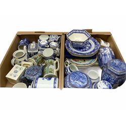 Collection of Ringtons tea and dinnerware, including a set of willow pattern milk jug and sugar bowl,  teapot and milk jug with floral decoration, a selection of storage jars etc, two boxes. 