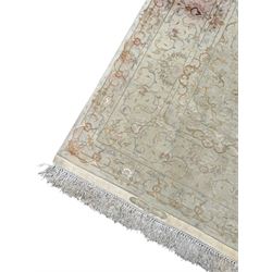 Persian Mahal densely knotted ivory ground carpet, floral rosette medallion surrounded by interlacing leafy branches and palmettes, scrolling border decorated with foliate motifs, within guard stripes, with signature panels to each end