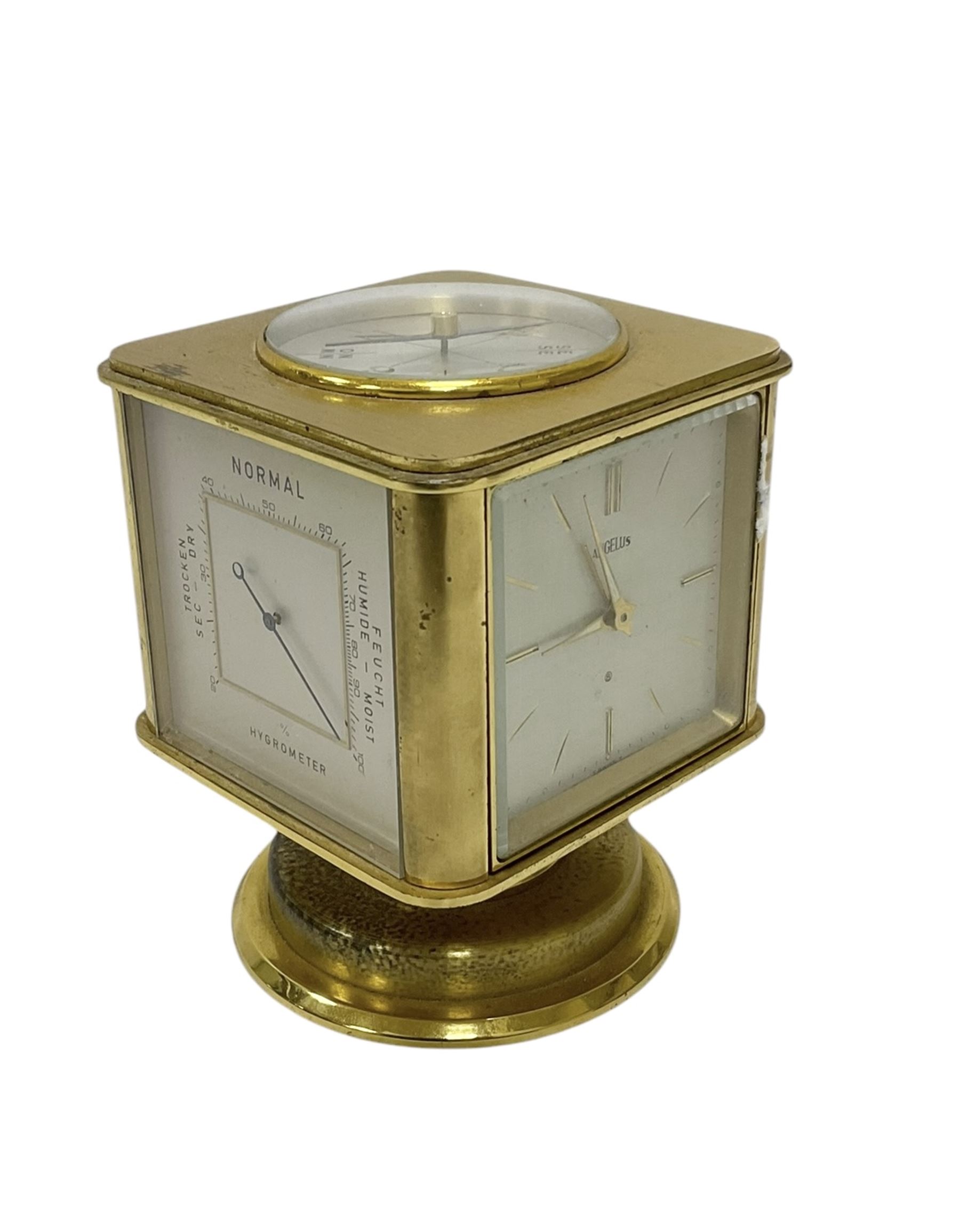 20th century-Angelus clock and weather station combined, in a satin gilt case with an 8-day clock movement, hygrometer, barometer, thermometer and compass.