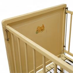 *Mid 20th century nursery set, comprising a cream painted metal cot with adjustable base, a wicker baby basket on wheeled stand, and a folding nursery screen with printed fabric panels decorated with playful animal and teddy bear motifs

Cot (H 112cm, W 136cm, D 77cm)
Screen (H 139cm, W 148cm) 
Basket (H 72cm, W 59cm, D 40cm)From the Kirkham Hall Attic & Cellar Collection, sold without reserve
