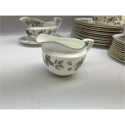Royal Worcester June Garland pattern tea and dinner wares, comprising thirteen dinner plates, twelve dessert plates, twelve side plates, six twin handled soup bowls and six saucers, six small bowls, sauce boat and stand, thirteen teacups and fifteen saucers, open sucrier, and milk jug