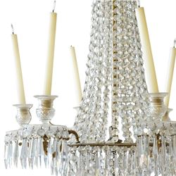 Regency Country House cut-glass and ormolu six light chandelier, the outer shaft with ormolu foliate moulding hung with octagonal and drop pendants, the impressive central shaft with cascading drops of cut-glass, the scroll branches with hob-nail cut candle holders and wax pans, with central similarly cut terminal
Provenance: property of a nobleman