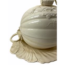 20th century Leeds creamware, comprising chestnut basket and stand, small tureen and cover, ladle, and associated stand, candlestick with stem modelled as a dolphin, teapot, tureen and cover in the form of a melon with fixed stand, and toast rack (toast rack a/f), each with impressed mark beneath. 