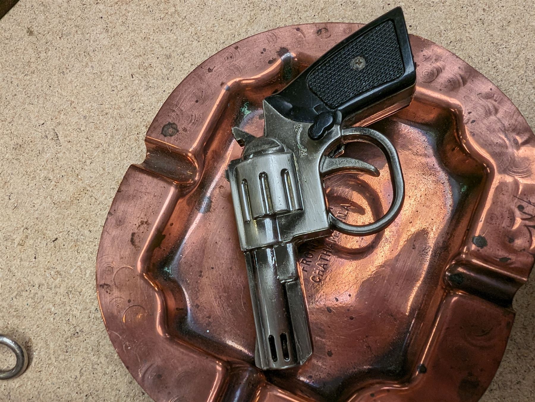 Trench art vase, copper ashtray with HMS Eskimo engraving, Dollond compass, brass three drawer telescope, pistol lighter etc