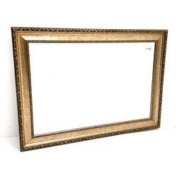 Rectangular wall mirror in swept gilt frame, bevelled glass plate