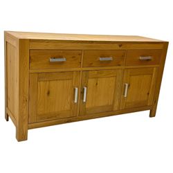 Light oak sideboard, fitted with three drawers and three cupboards, metal handles