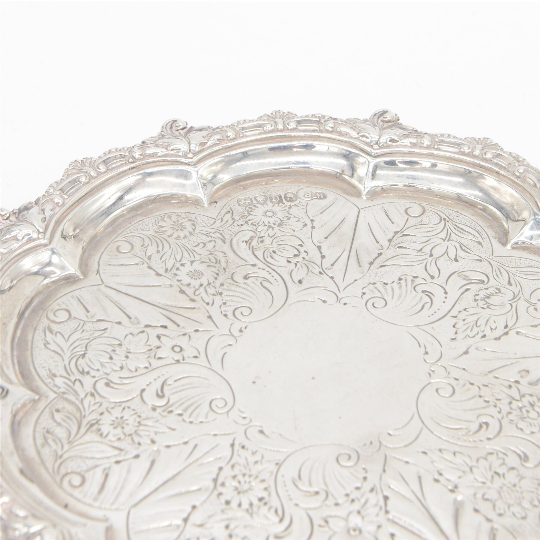 George IV silver waiter, of typical form, with shaped rim embossed with C scrolls, upon three scrolling pad feet, hallmarked William Brown London 1829, D20cm