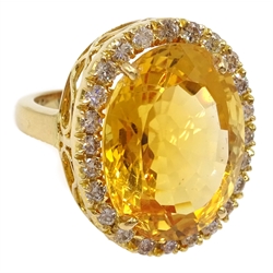  Large oval citrine and diamond cluster ring stamped 18K, citrine approx 20 carat, diamond total weight 0.7 carat  