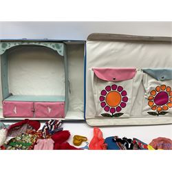 The World of Barbie Double Doll Case containing a quantity of assorted doll's clothing; together with two large and one small fashion dolls.